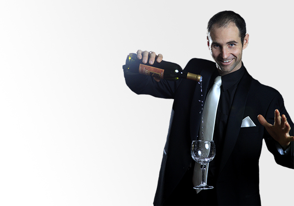 Craig performing an illusion with a floating wine glass